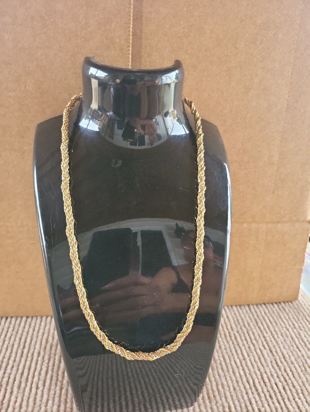 twisted rope-style chain necklace featuring a mix of yellow gold and silver-tone